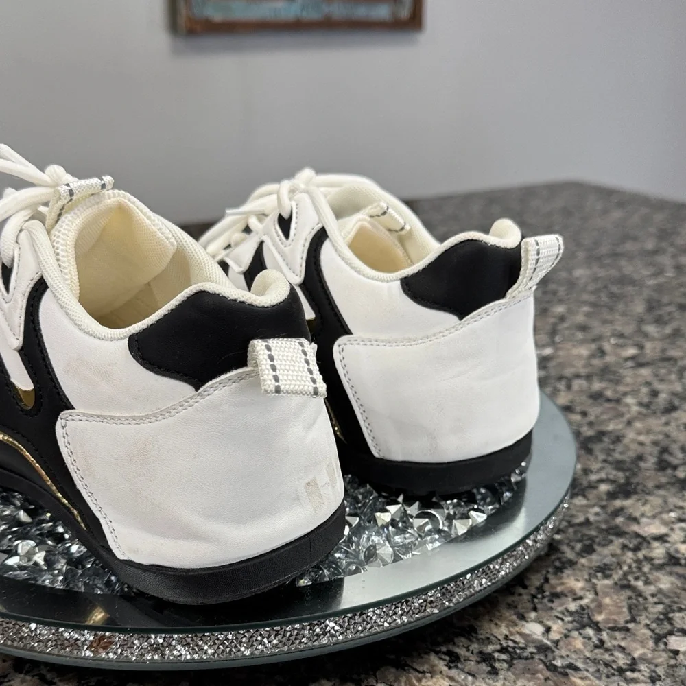 White and Black womens fashion Sneakers with gold accents EUC 10